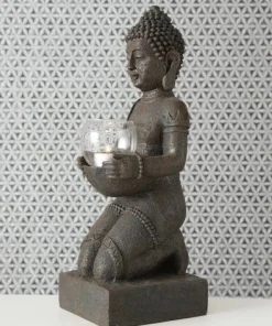 Knælende Buddha med lysglas